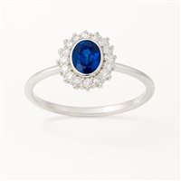 Anello da donna in oro bianco 18 kt con zircone blu ovale 6x8 mm e contorno di zirconi – Misura 16 – 3.10 g – Idee Preziose dal 1987 - IP.AK18B/13